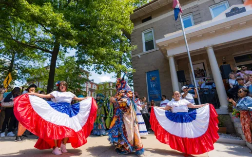 People dancing outside an embassy at Passport DC event